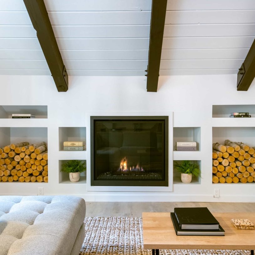 Cozy living room with fireplace, perfect for a Lake Arrowhead Family Vacation retreat.