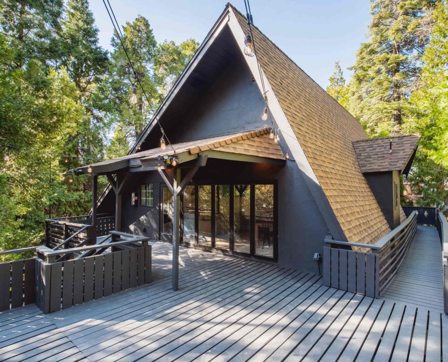 A stunning cabin deck in a forest, perfect for a cozy mountain retreat near Lake Arrowhead.