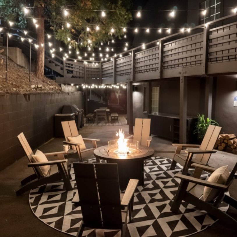 Cozy outdoor fire pit scene at nighttime, perfect for a Lake Arrowhead Escape.