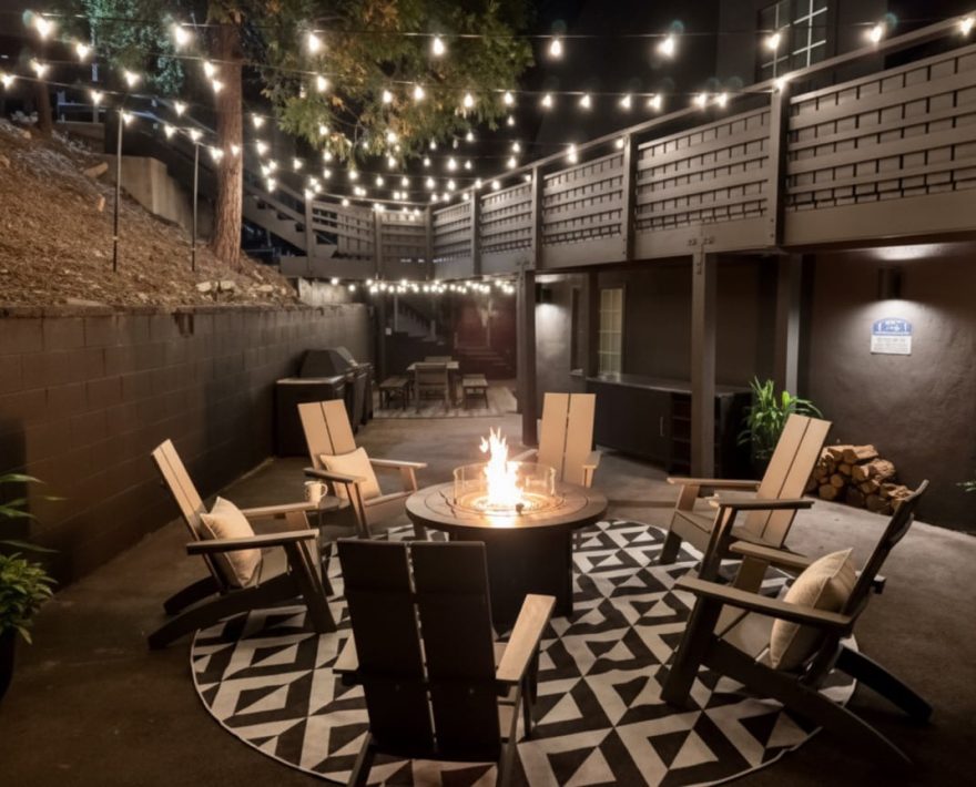 Cozy outdoor fire pit scene at nighttime, perfect for a Lake Arrowhead Escape.
