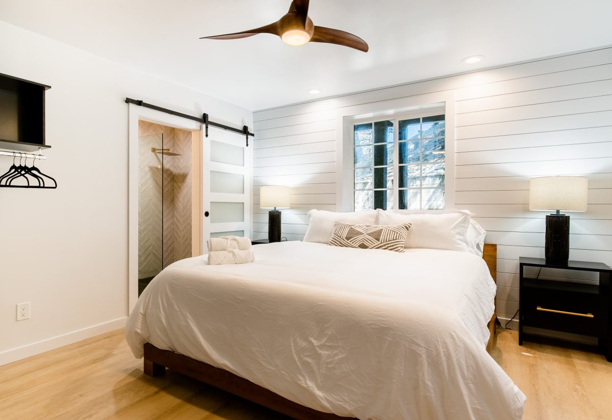 Modern room with a cozy bed at a Boutique Hotel Near The Village in Lake Arrowhead.