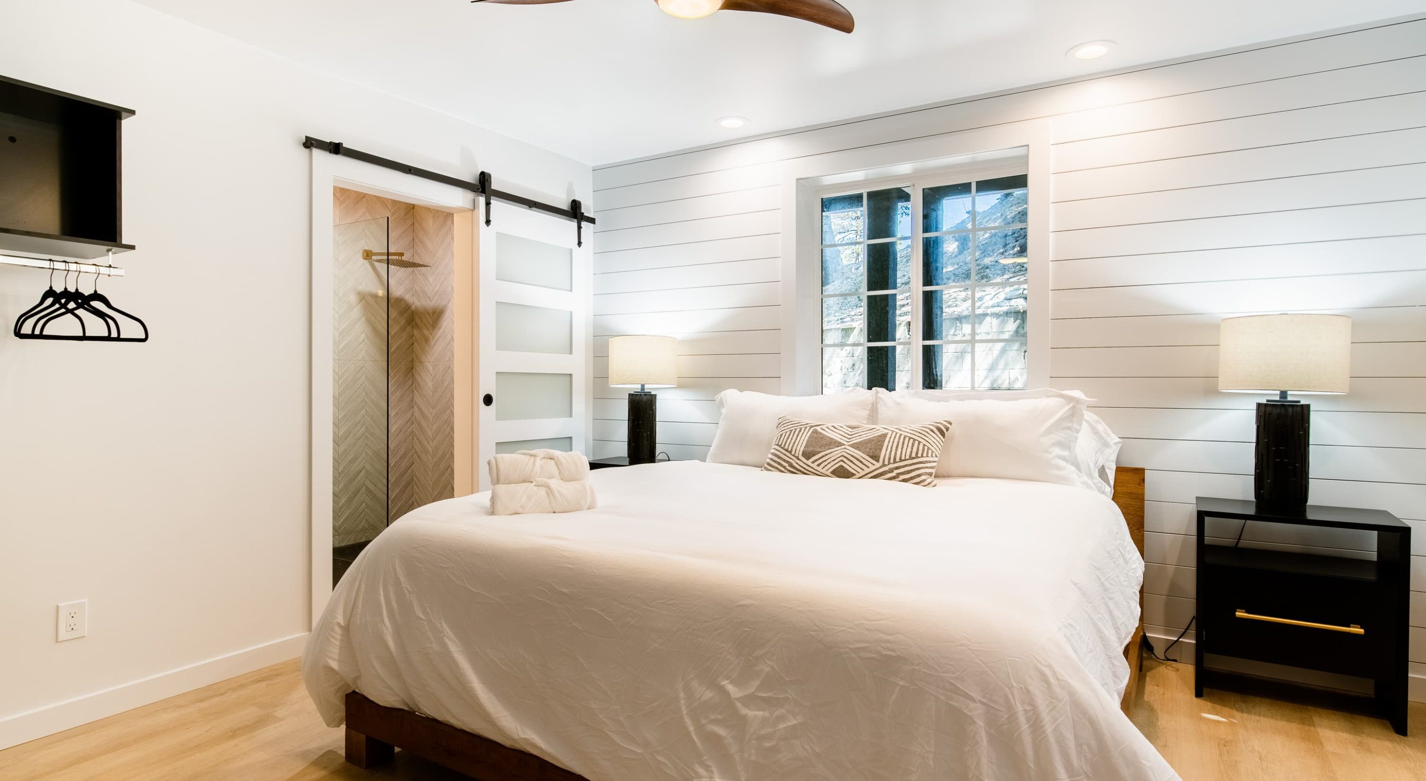 Modern room with a cozy bed at a Boutique Hotel Near The Village in Lake Arrowhead.
