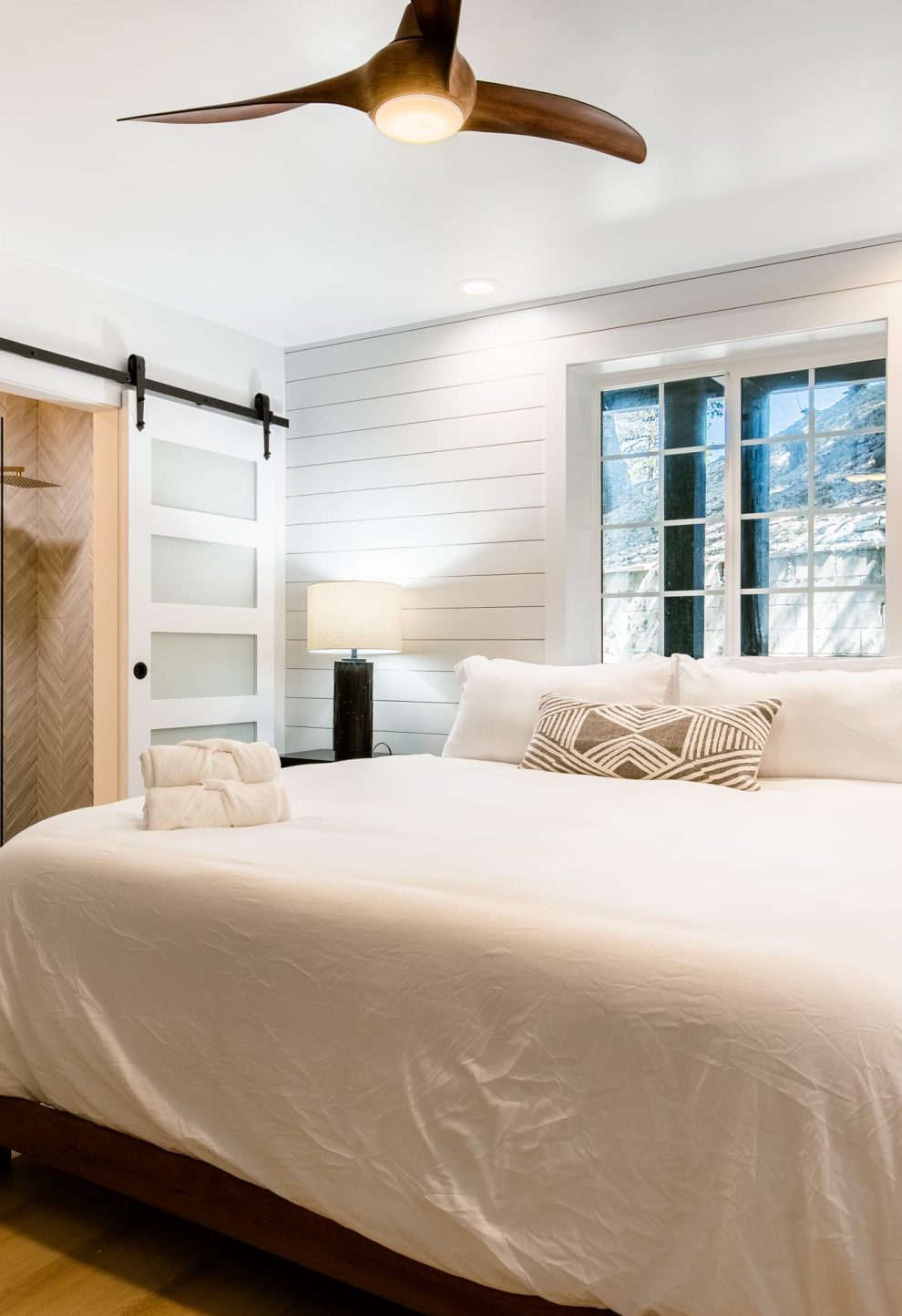 Modern room with a cozy bed at a Boutique Hotel Near The Village in Lake Arrowhead.