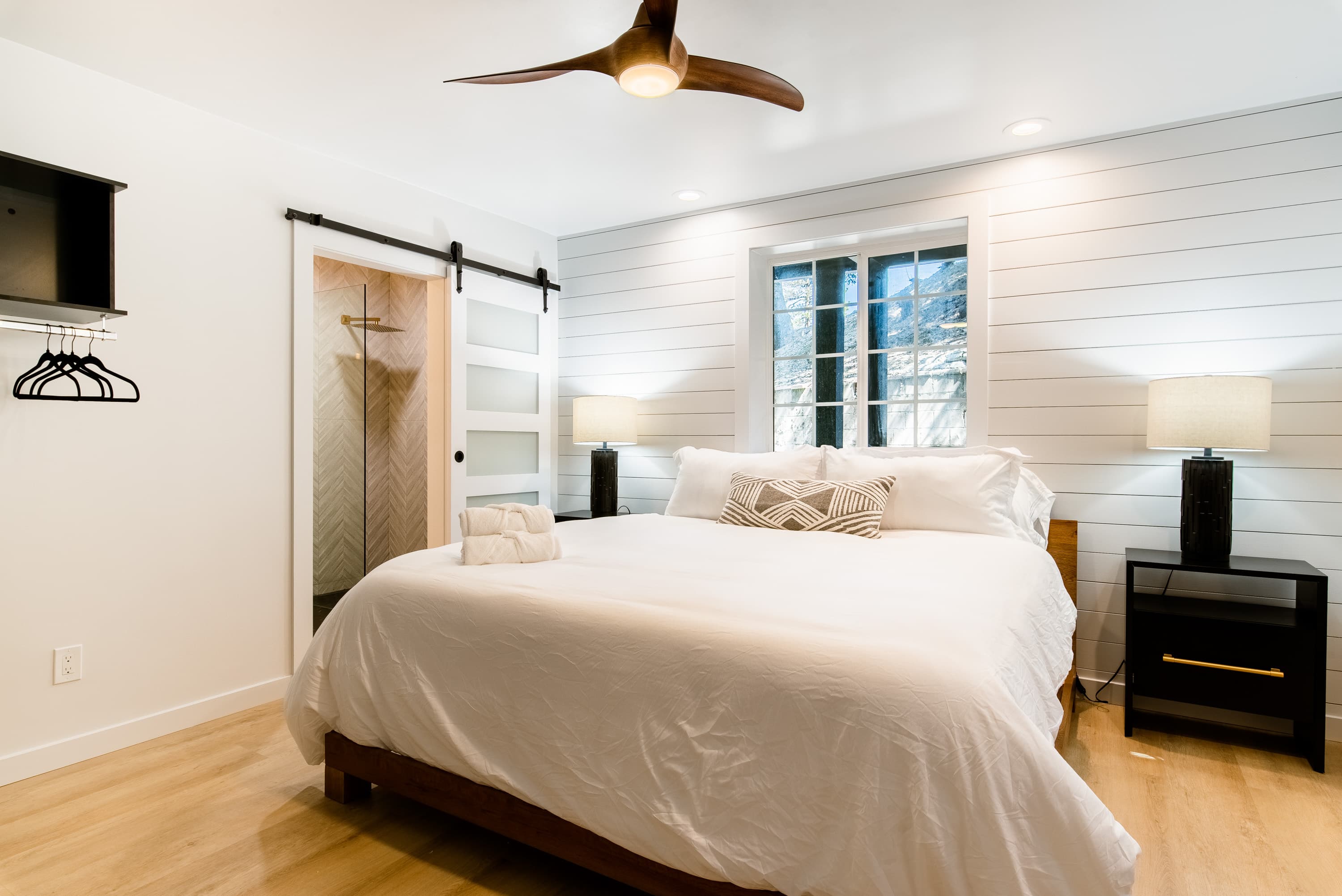Modern room with a cozy bed at a Boutique Hotel Near The Village in Lake Arrowhead.