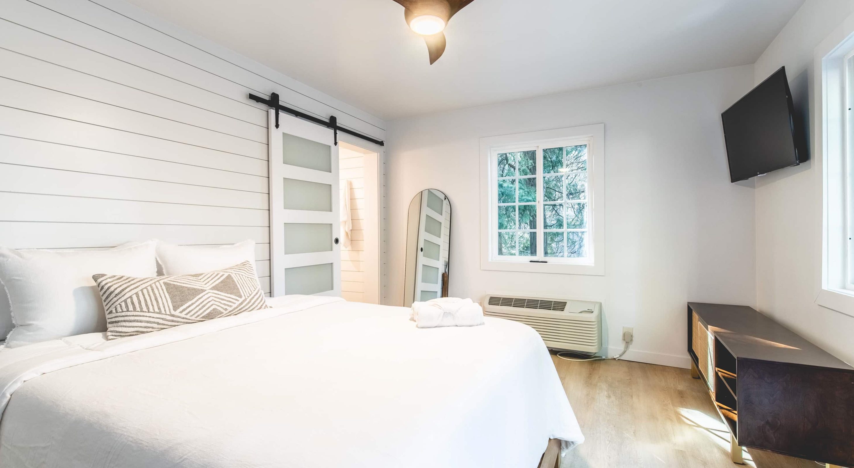 Cozy room in a Boutique Hotel near The Village, featuring serene decor and modern style.