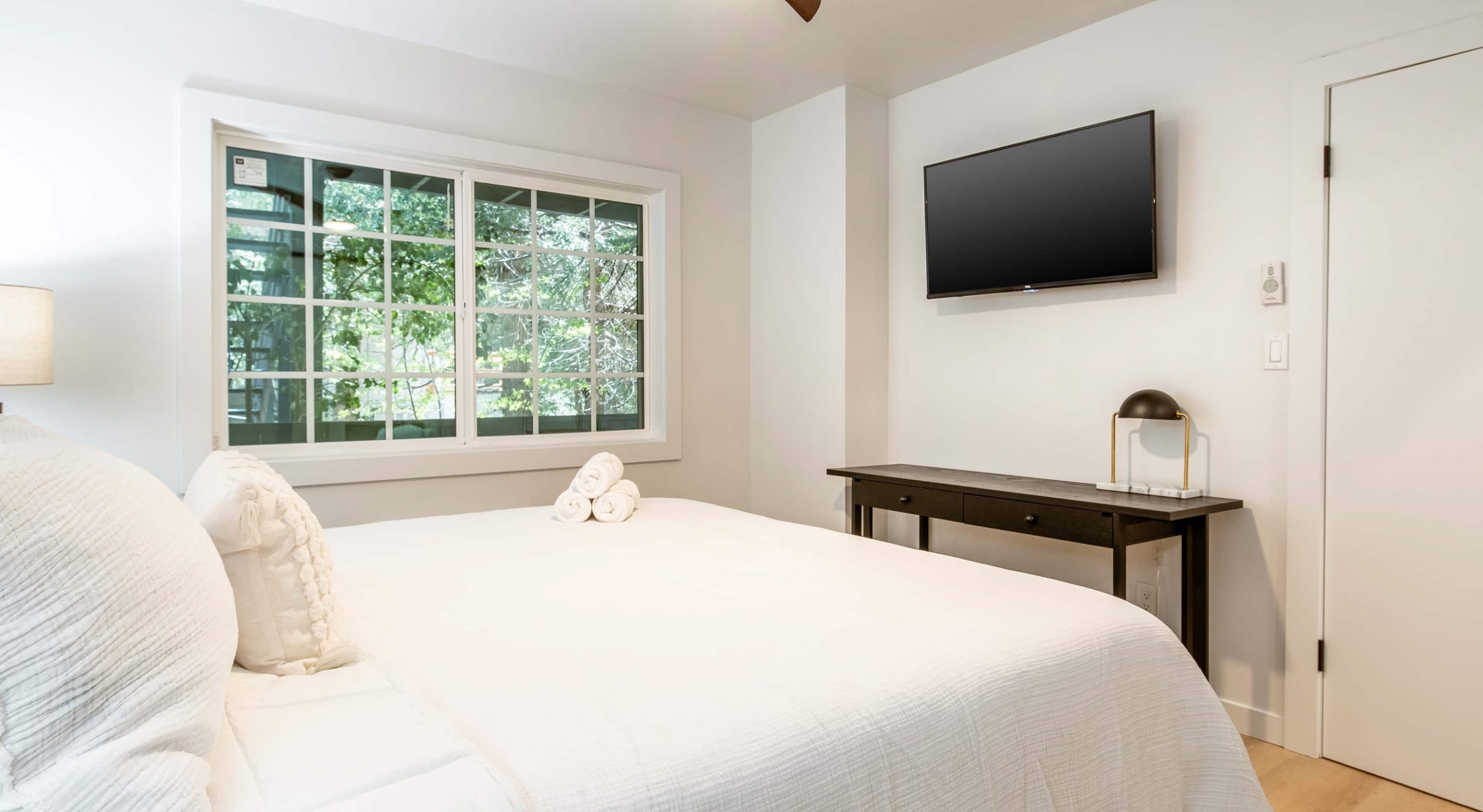 Cozy room with fresh linens in a boutique hotel near the village, ideal for relaxation.