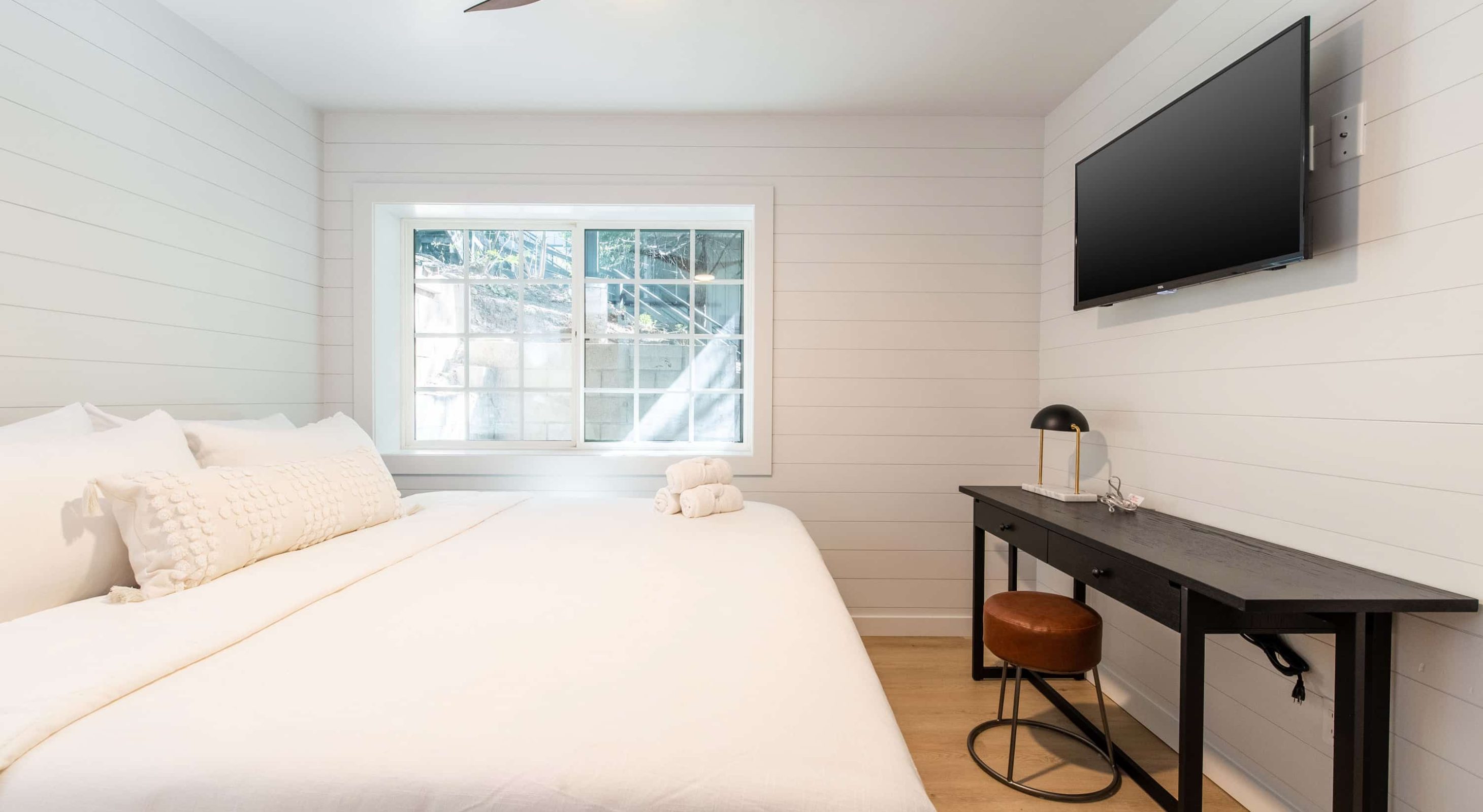 Cozy bedroom interior perfect for a Lake Arrowhead Family Vacation with modern decor.