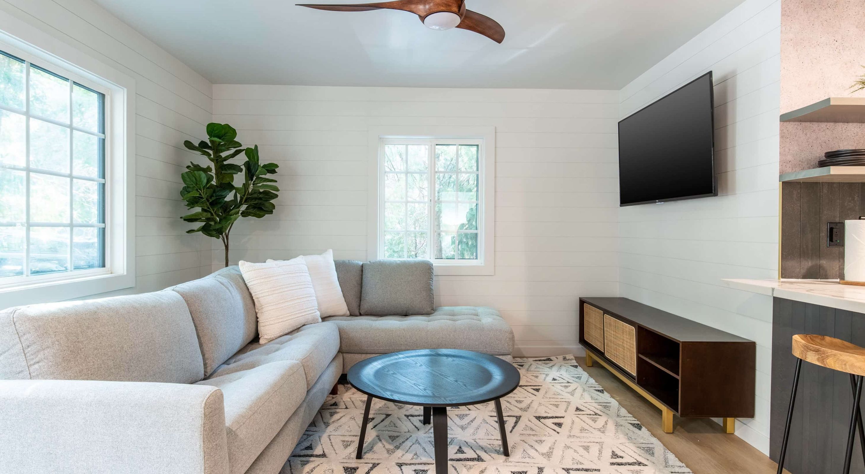 Cozy living area with sofa, stylish decor, ideal for a Lake Arrowhead family vacation.
