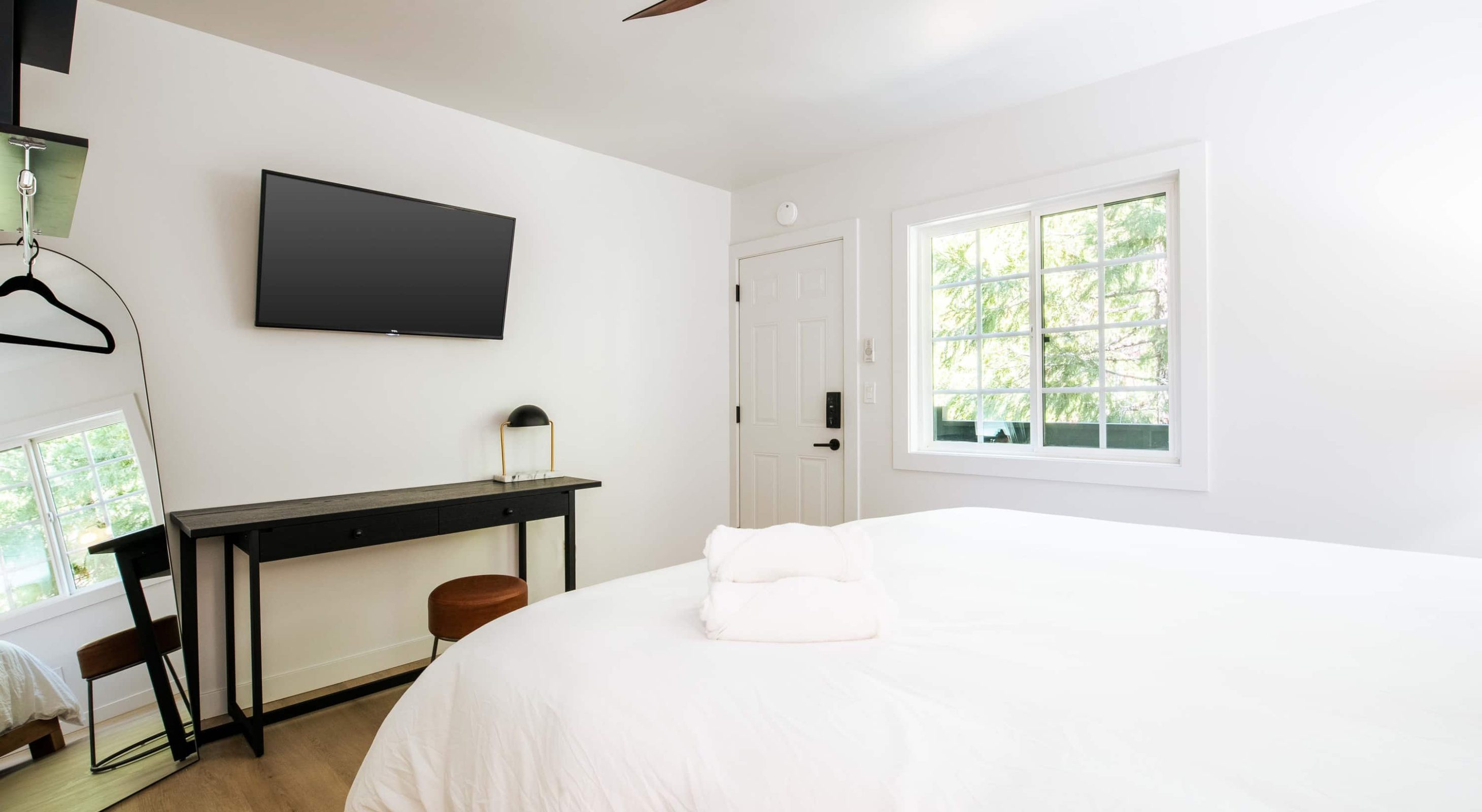 Cozy room in a Boutique Hotel near The Village, featuring a plush bed and serene view.