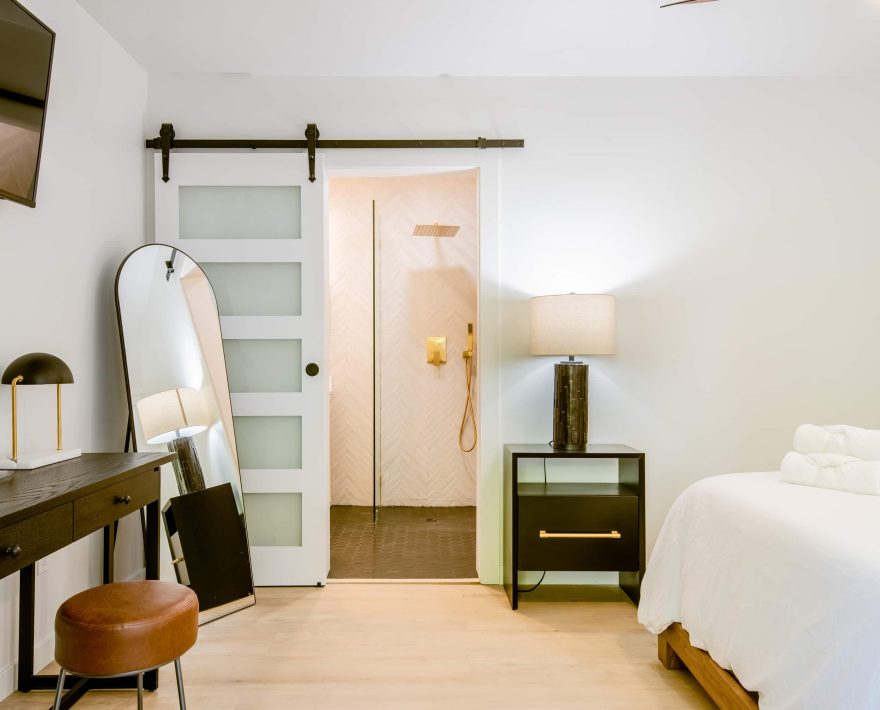 Modern room at a Boutique Hotel Near The Village; features elegant decor and cozy ambiance.