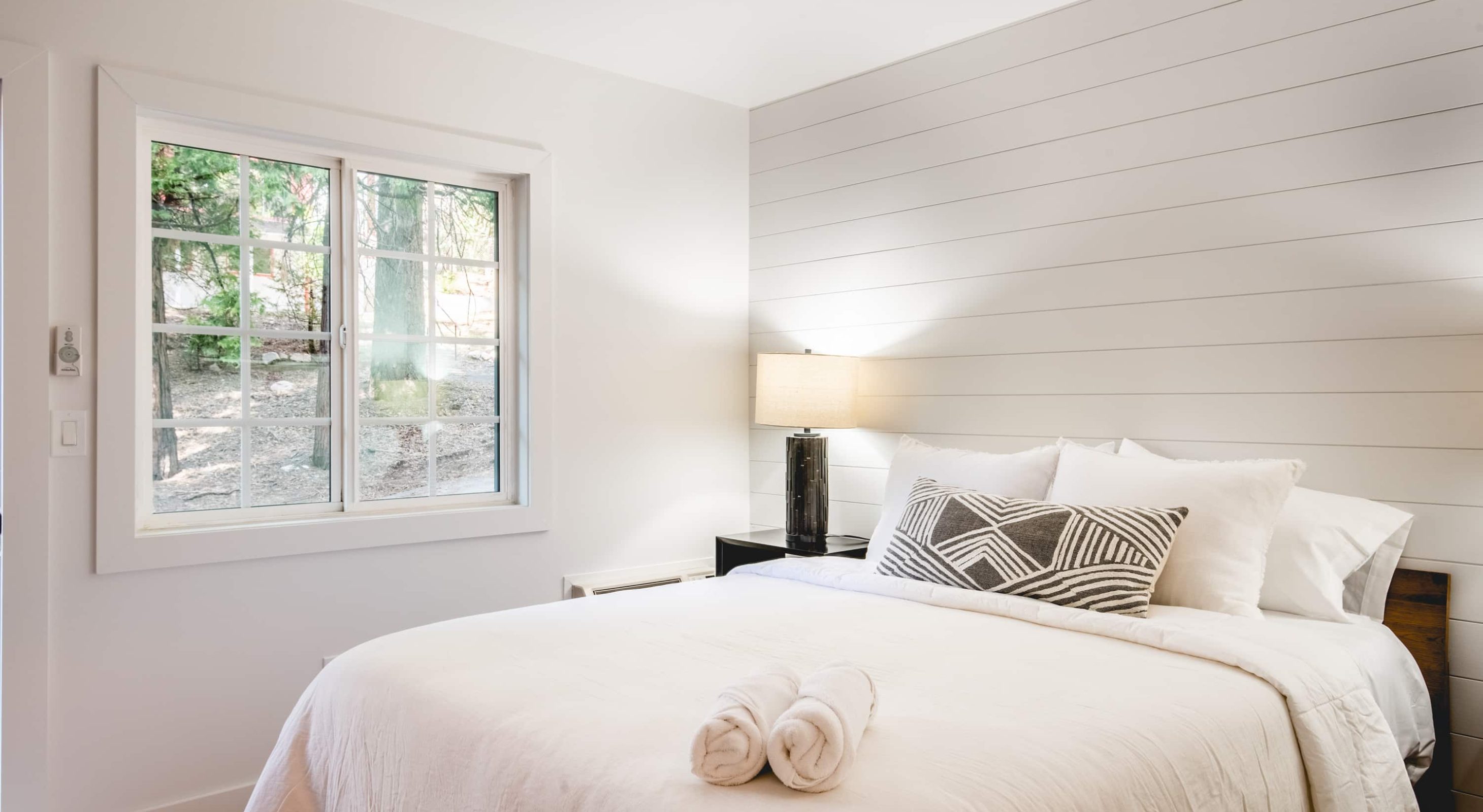 Cozy mountain retreat bedroom offering serene views, perfect for a Lake Arrowhead escape.