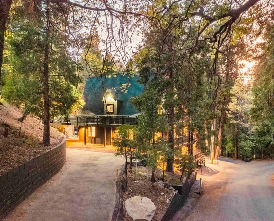 Cozy mountain retreat nestled among trees, ideal for a Lake Arrowhead family vacation.