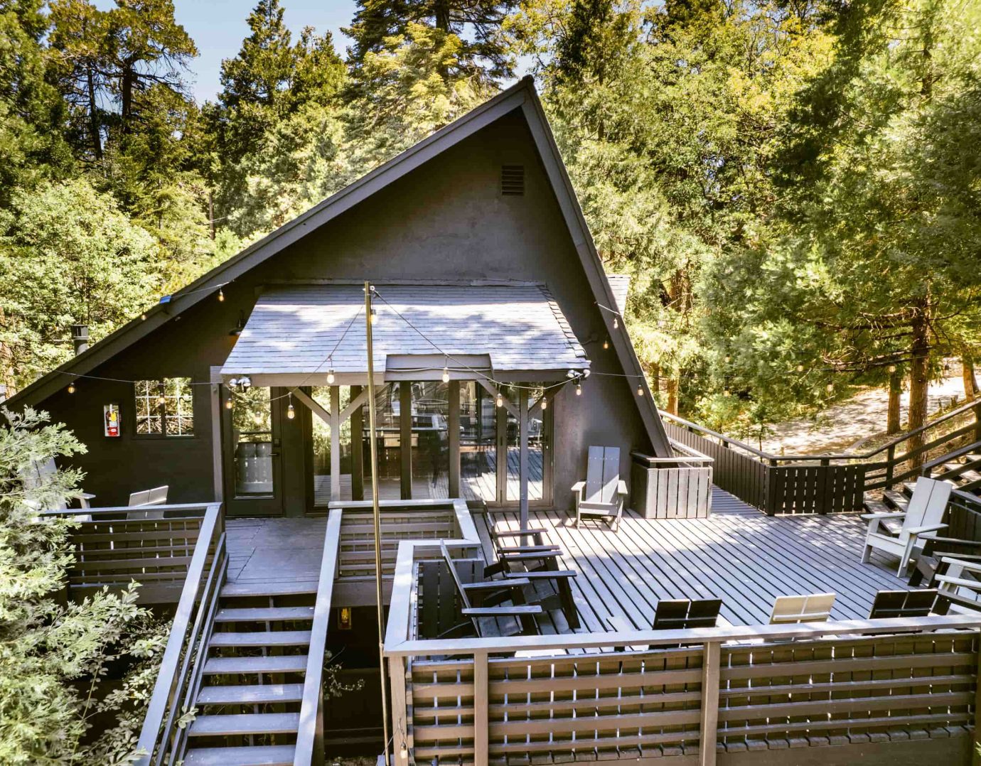 Charming mountain cabin surrounded by trees, perfect for a Lake Arrowhead Escape.