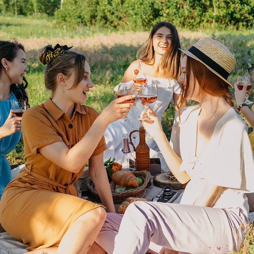 Group enjoying a sunny picnic, ideal for a Lake Arrowhead Family Vacation retreat.