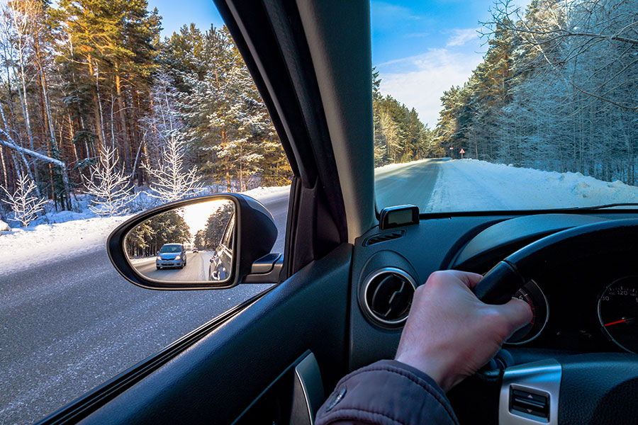 Inside view of car on snowy winter road