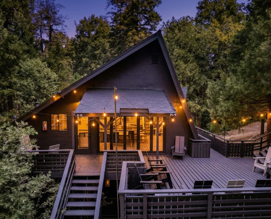 Exterior of Lake Arrowhead mountain hotel with large deck and lush trees