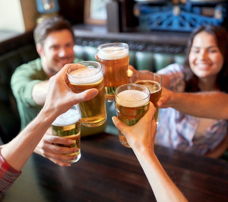 group of friends toasting at brewery