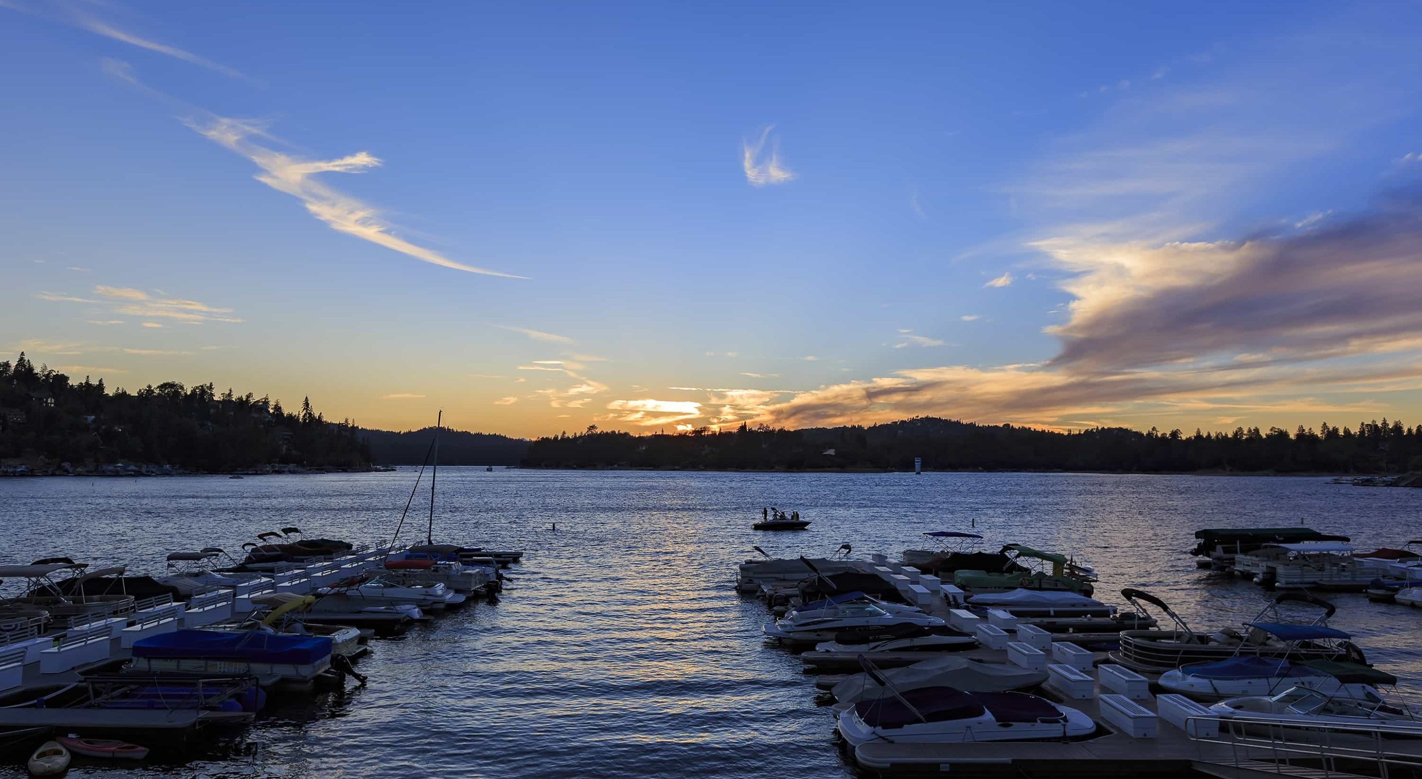 Scenic sunset view over Lake Arrowhead marina, a perfect Lake Arrowhead family vacation.