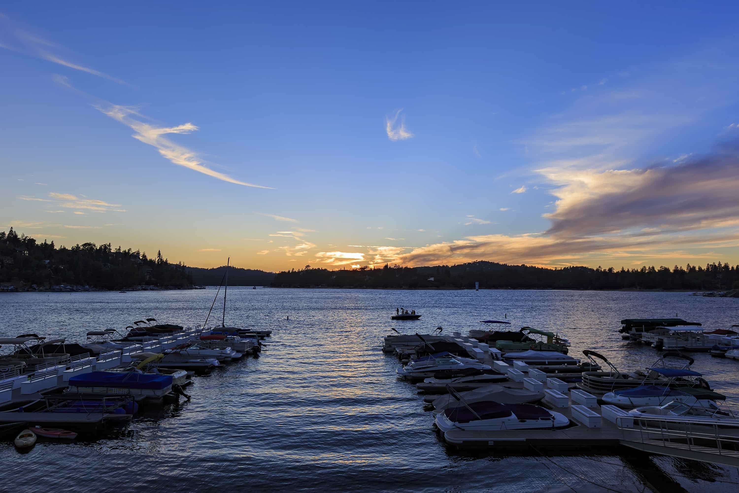 Scenic sunset view over Lake Arrowhead marina, a perfect Lake Arrowhead family vacation.